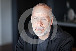 Serious Senior Man looking At The Camera. With a gray beard. Depression