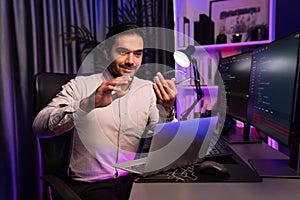 Serious smart IT developer meeting via application team record laptop. Surmise.