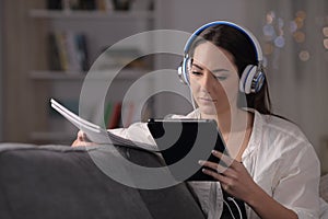 Serious student e-learning comparing notes in the night