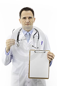 Serious surgeon with blank clipboard, copy space for text. Health recommendation