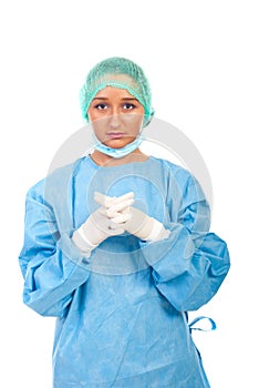 Serious surgeon woman with sterile gloves