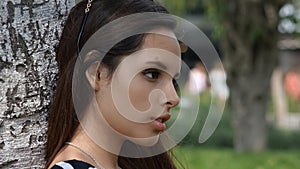 Serious Teen Girl In Park