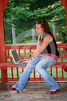 Teen Girl with Laptop on Bench
