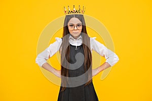 Serious teenager girl. Little queen wearing golden crown. Teenage girl princess holding crown tiara. Prom party