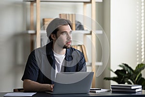 Serious thoughtful business professional man thinking over work project