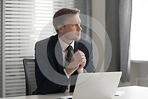 Serious thoughtful businessman feel doubtful concerned about business challenge photo