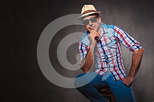 Serious thoughtful senior casual man wearing hat and sunglasses