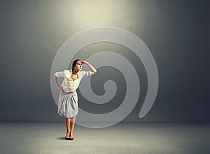 Serious woman attentively peered