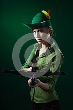 Serious woman with crossbow photo