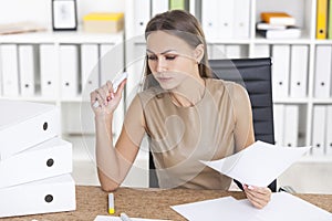 Serious woman doing paperwork