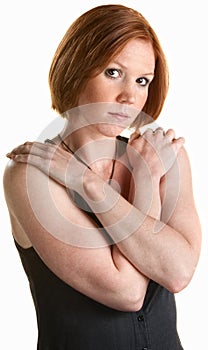 Serious Woman Holding Shoulders