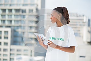 Serious woman holding tablet pc