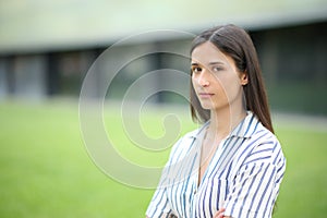 Serious woman looking at camera in a business center