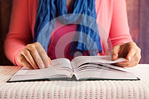 Serious woman student read book, religion or education concept