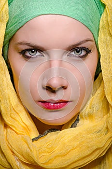 Serious woman wearing colourful headscarf