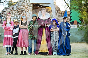 Serious young actors in costume