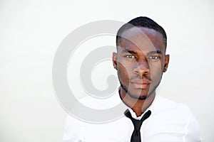 Serious young african man in shirt and tie