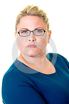 Serious young blond businesswoman in glasses