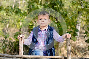 Serious Young Boy Outdoors