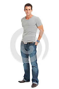 Serious young man, portrait in a studio with casual fashion and confidence with pride. White background, tshirt and