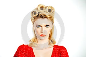 Serious young woman. Crazy furious young pin up woman standing over white background. Pin up woman portrait. Beautiful