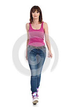 Serious Young Woman Is Walking Towards Camera