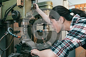 Seriously milling machine factory female worker