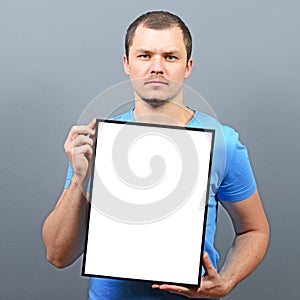 Serous looking man holding empty board - Perfect for raising awareness of something