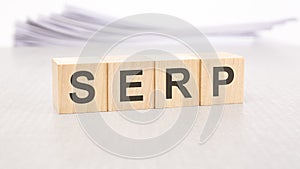 serp word written on wood cubes with white background