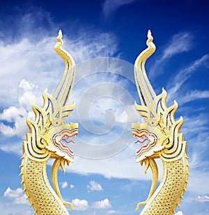 Serpent king of nagas statue on blue sky