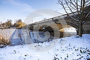 Serpentine bridge and frozen lake