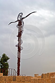 The serpentine cross sculpture the Brazen Serpent created by Italian artist Giovanni Fantoni on top of Mount Nebo.