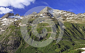 Serpentine road connecting alpine passes Furka and Grimsel in Swiss Alps