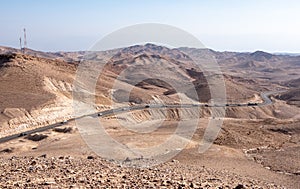 Serpentine road descending from city Arad to the Dead Sea, Judaean Desert, Israel.