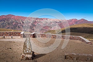 Serrania de Hornocal, the fourteen colors hill and altitude sign at Quebrada de Humahuaca - Humahuaca, Jujuy, Argentina photo