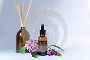 Serum Cosmetic Bottle With Peptides And Retinol with flowers