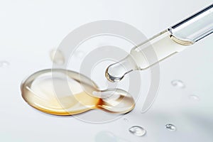 Serum dropper and skin care cosmetics product drop close-up on white background