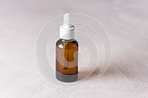 Serum in Glass Bottle on Gray Background Aromatherapy oil Concept of Natural Cosmetic Horizontal