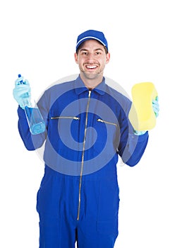 Servant holding cleaning spray and sponge