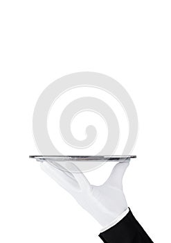 Servant white glove holds stainless steel tray