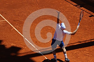 Andy Murray serving at the practice.