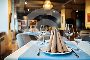 Served banquet restaurant table with wine glasses