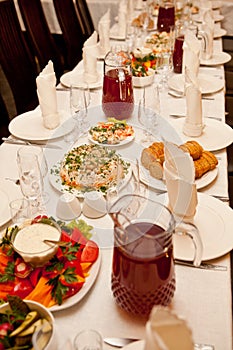 Served for a banquet table with glasses and white napkins and salads