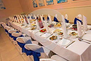 Served festive table with dishes in the restaurant waiting