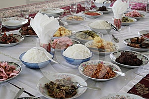 Served food on floor dining style during Ramadan with bokeh background photo