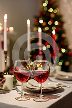 Served holiday table with two wine glasses