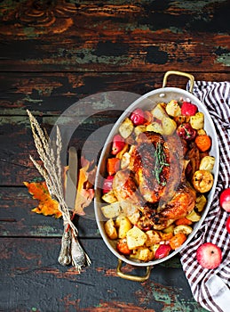 Served roasted Thanksgiving Turkey with vegetables on wooden background
