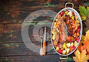 Served roasted Thanksgiving Turkey with vegetables on wooden background