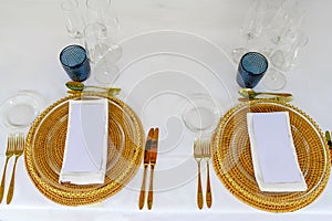 Served table with glassware and napkins