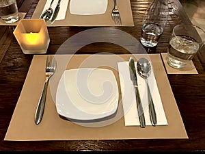 Served table in restaurant with dishes and glasses